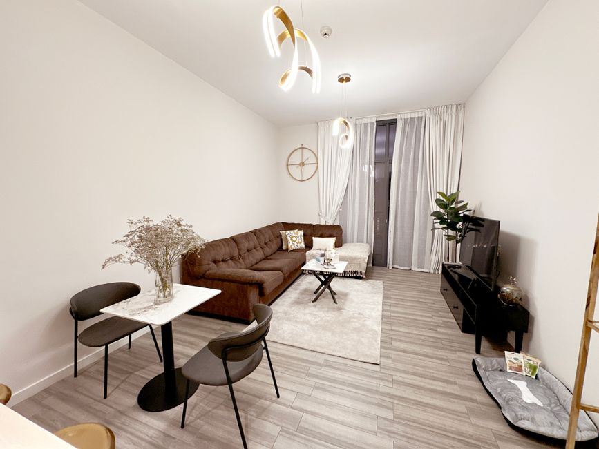 Stylish modern living room with minimalist decor and cozy ambiance.